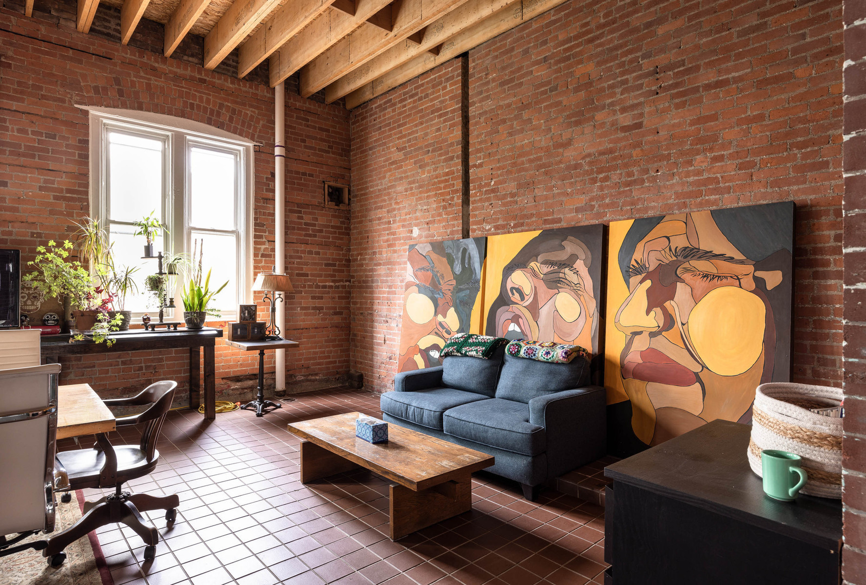 Interior view of photography and videography studio lounge at Enginehouse 27 located in Detroit, MI available for daily rental which includes, grip, lighting, capture cart, camera stand, lounge, generous space.