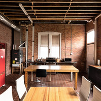 Interior view of photography and videography studio lounge at Enginehouse 27 located in Detroit, MI available for daily rental which includes, grip, lighting, capture cart, camera stand, lounge, generous space.