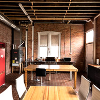 Interior view of photography and videography studio lounge at Enginehouse 27 located in Detroit, MI available for daily rental which includes, grip, lighting, capture cart, camera stand, lounge, generous space.