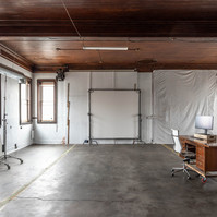 Interior view of photography and videography studio Enginehouse 27 located in Detroit, MI available for daily rental which includes, grip, lighting, capture cart, camera stand, lounge, generous space.