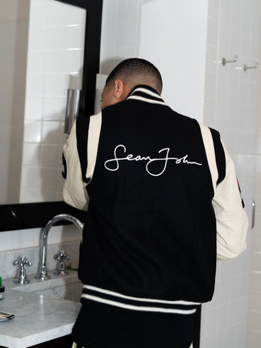 Stylized editorial portrait of Sean Brown wearing a black-and-tan coat, part of Bully Magazine’s Image Issue. Creative production by Rashaad Denzel.