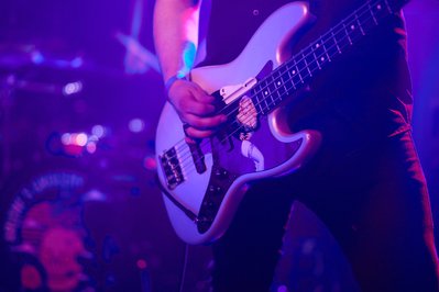 Guitar solos frozen in time through expert rock music photography.
