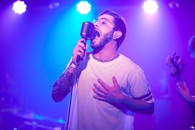 Intense rock vocalist portraits against NYC's urban backdrop.