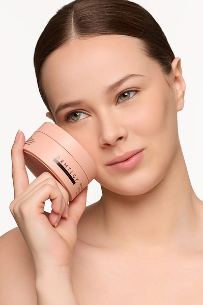 NYC beauty photographer shooting skincare ad with fresh-faced model.
