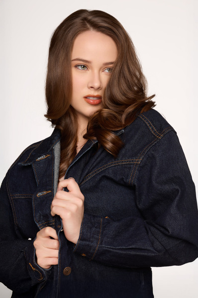 Studio fashion shoot highlighting denim jacket styling for NYC-based apparel brand.