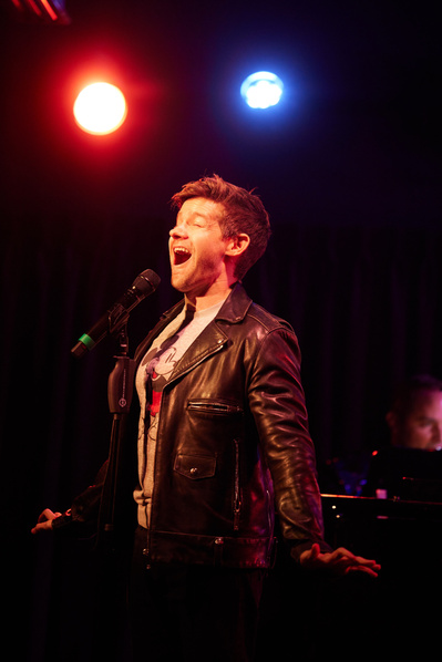 Vibrant stage photography in NYC, showcasing dramatic lighting and movement.