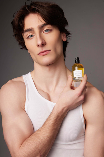 Beauty brand campaign photography showcasing fragrance products with clean, professional studio lighting.