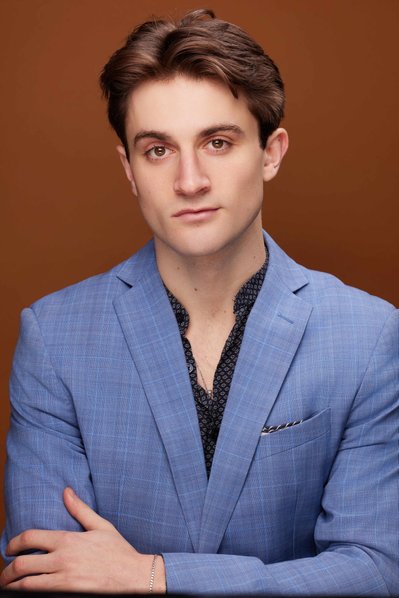 Close-up actor headshot with confident expression, taken by a professional NYC photographer.
