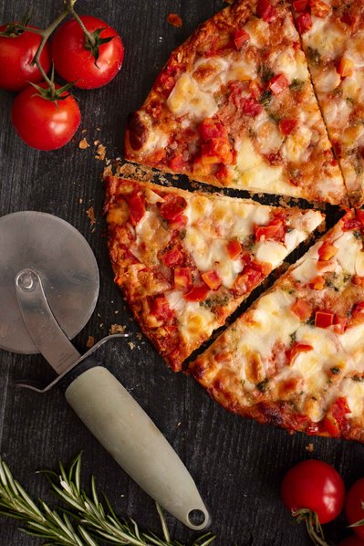 Overhead shot of artisan pizza photographed in NYC for restaurant menu.