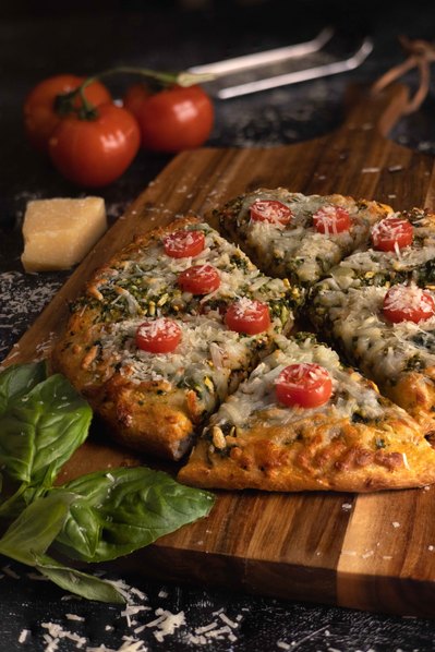 NYC pizza photographer capturing cheesy slice pull for restaurant marketing.