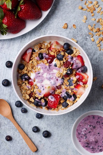 NYC food photographer capturing vibrant açaí bowl with fresh fruit toppings.