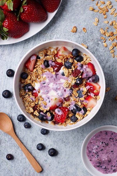 NYC food photographer capturing vibrant açaí bowl with fresh fruit toppings.