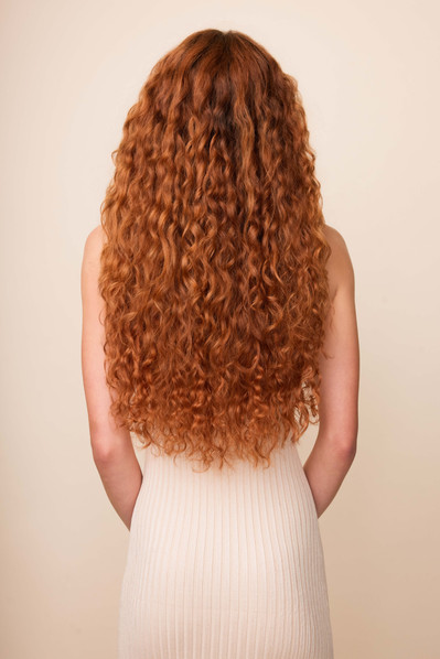 Bebonia NYC studio shoot capturing seamless curly hair extensions with natural texture.