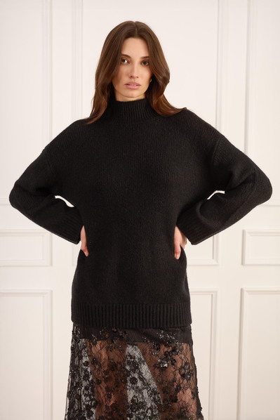 NYC ecommerce photography of women’s knitwear styled for seasonal launch.