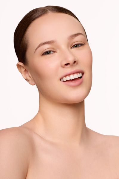 Skincare brand campaign with close-up model portrait in NYC photo studio.