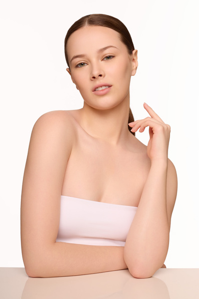 Minimal skincare routine photoshoot with model in NYC-based beauty studio.