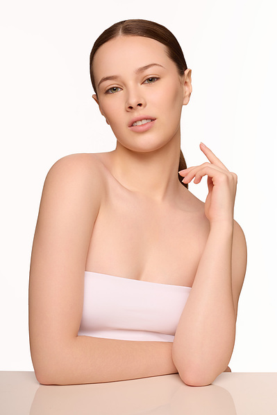 Minimal skincare routine photoshoot with model in NYC-based beauty studio.