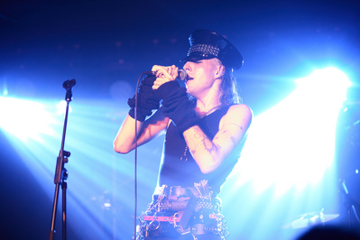 Energetic rock frontmen commanding the stage.