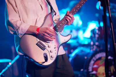 Guitarist solo moments frozen in captivating rock photography.