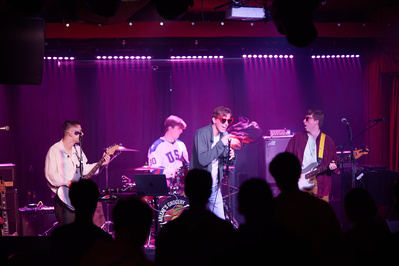 Rock band group shots showcasing camaraderie and passion.