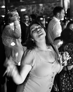 A pretty girl mugging for the camera during a wedding reception in London England