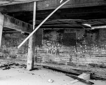 Graffiti "Sandy Won" under the boardwalk destroyed by Hurricane Sandy in Rockaway Beach Queens, NY.