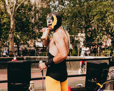 Lucidor announcer for bike polo at Sara Roosevelt Park in the Lower East Side of New York City