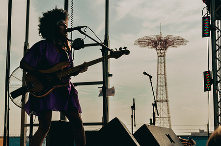 Kamara Thomas Earl Greyhound with the Coney Island parachute jump in the background  - Village Voice Siren Festival, Coney Island, Brooklyn, 2010