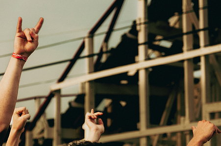 Throwing up the horns for ​ for Ted Leo and The Pharmacists with the Cyclone roller coaster in the background  - Village Voice Siren Festival, Coney Island, Brooklyn, 2010 