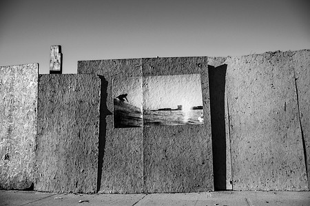 Poster of a surfer on an abandoned lot in Rockaway Beach Queens, NY.