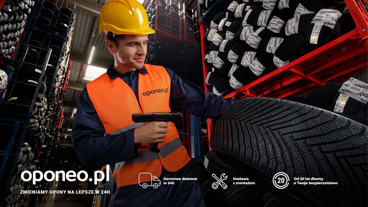 Campaign still showcasing oponeo.pl employee in action, scanning a tire's label. On-set lifestyle shot blending commercial photography techniques with storytelling-driven composition