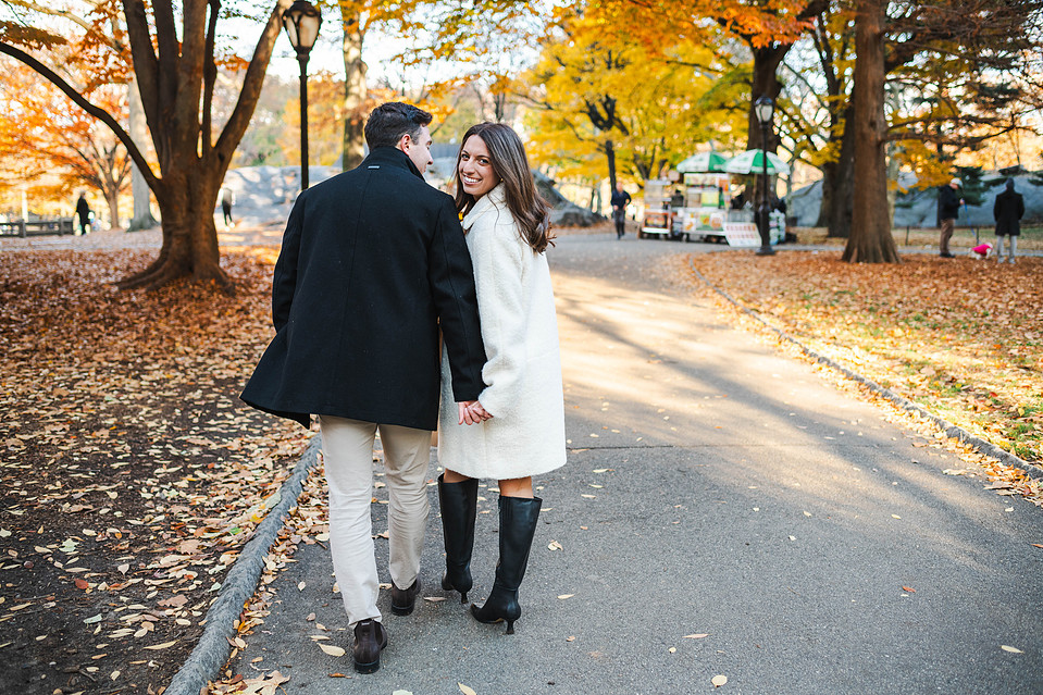 Couple walking through Central Park during NYC engagement session