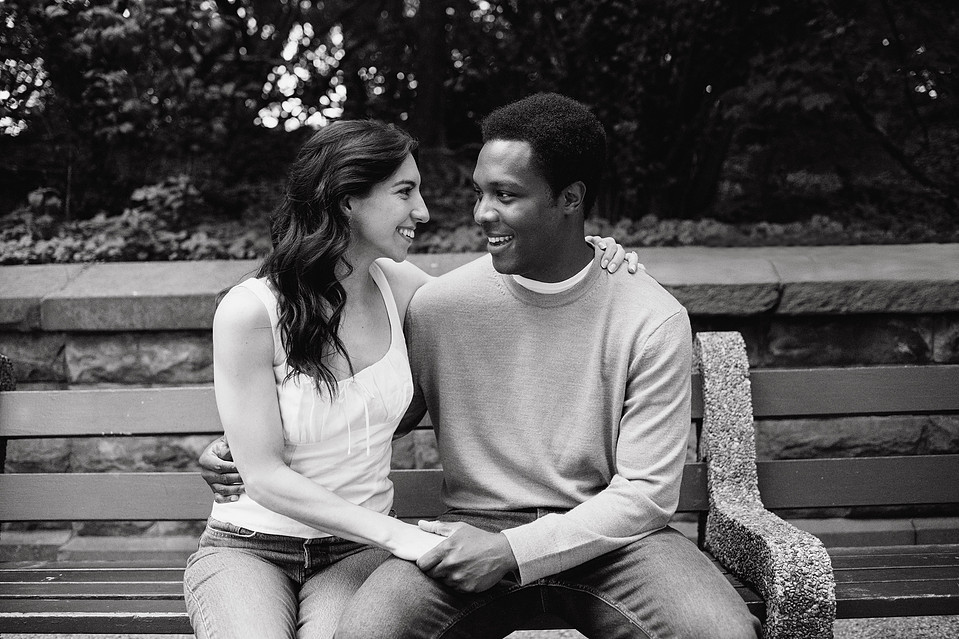 Engaged couple sitting in Prospect Park during a Brooklyn engagement session