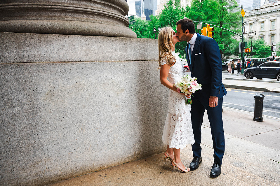 Wedding couple walking outside the David N. Dinkins Manhattan Municipal Building