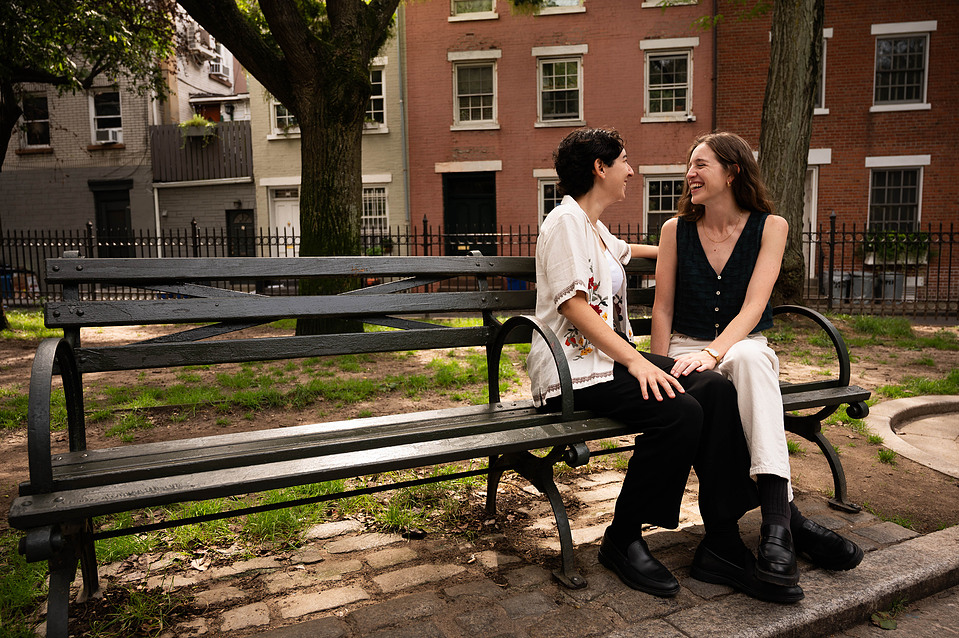 Couple posing in front of a classic Brooklyn brownstone near Cobble Hill Park