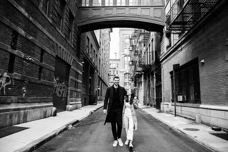 Engagement photo under the iconic Staple Street Skybridge in Tribeca, NYC