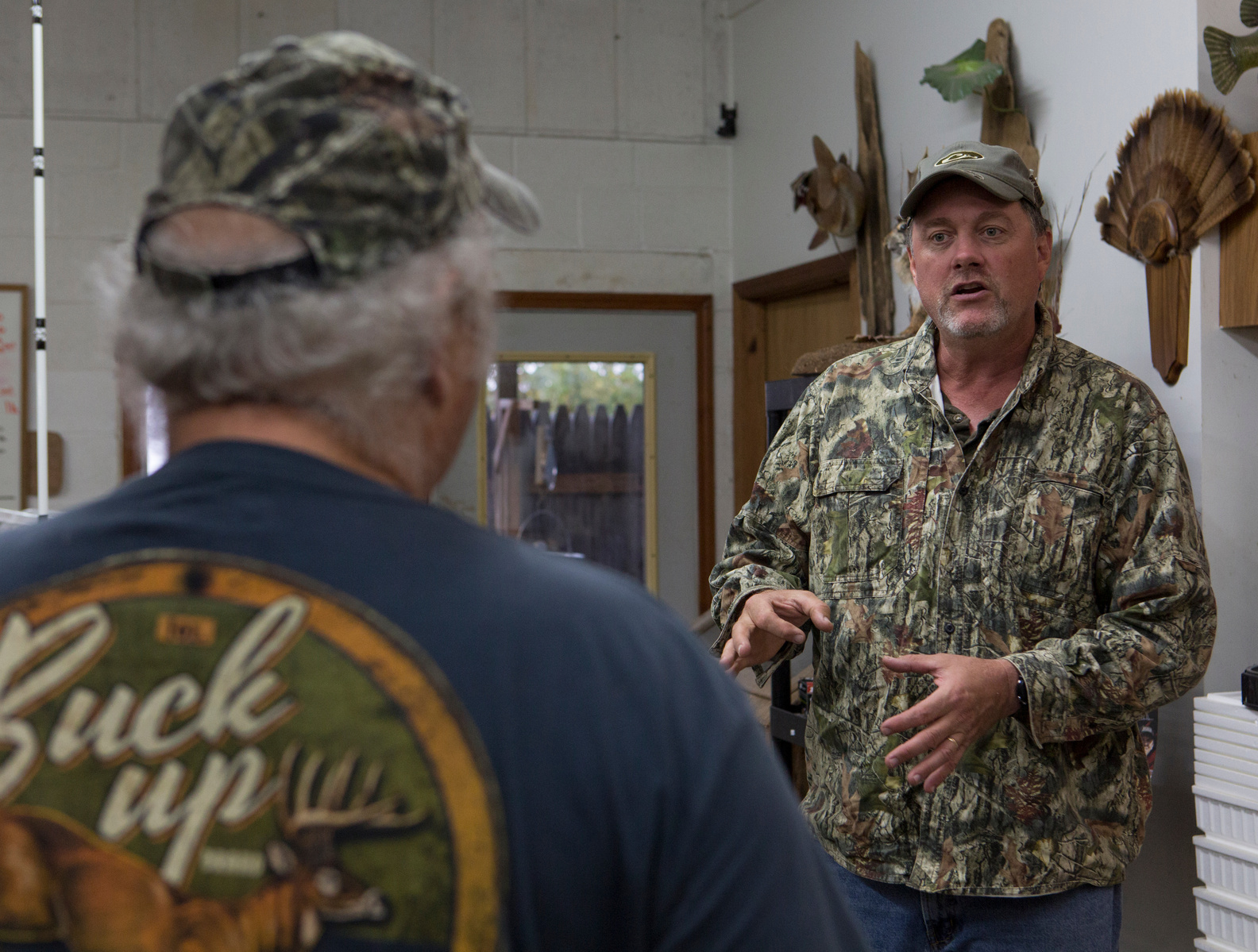 Tony Snelling, a frequent customer, comes to Howard's Bait and Taxidermy to pick up minnows. He talks with Howard about the day's fishing spots.