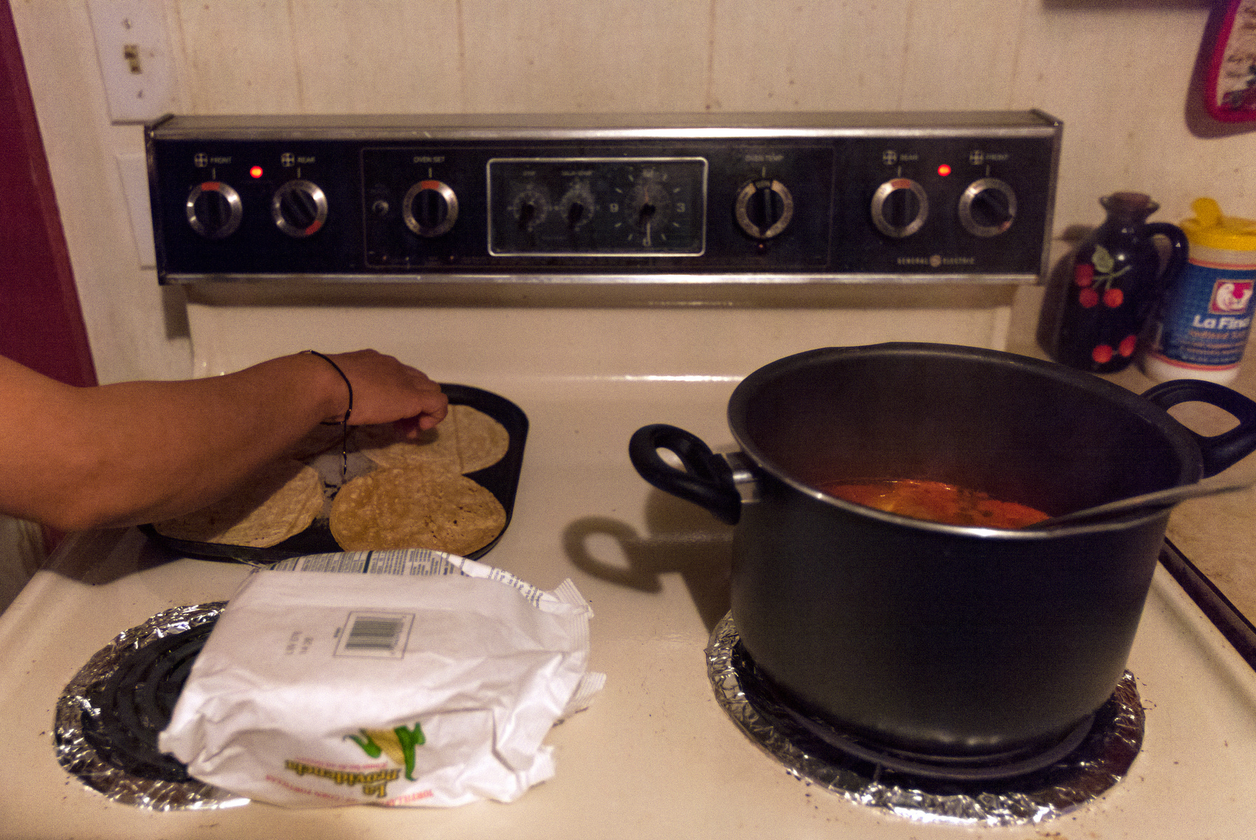Sylvia Ramirez Reyes prepares a traditional Mexican dinner of tortillas and chicken soup in her home in Austin, Ky. on Monday, April 4. Ramirez Reyes and Tzanahua Zacarias have continued to practice their Mexican culture during their time here in the Unit