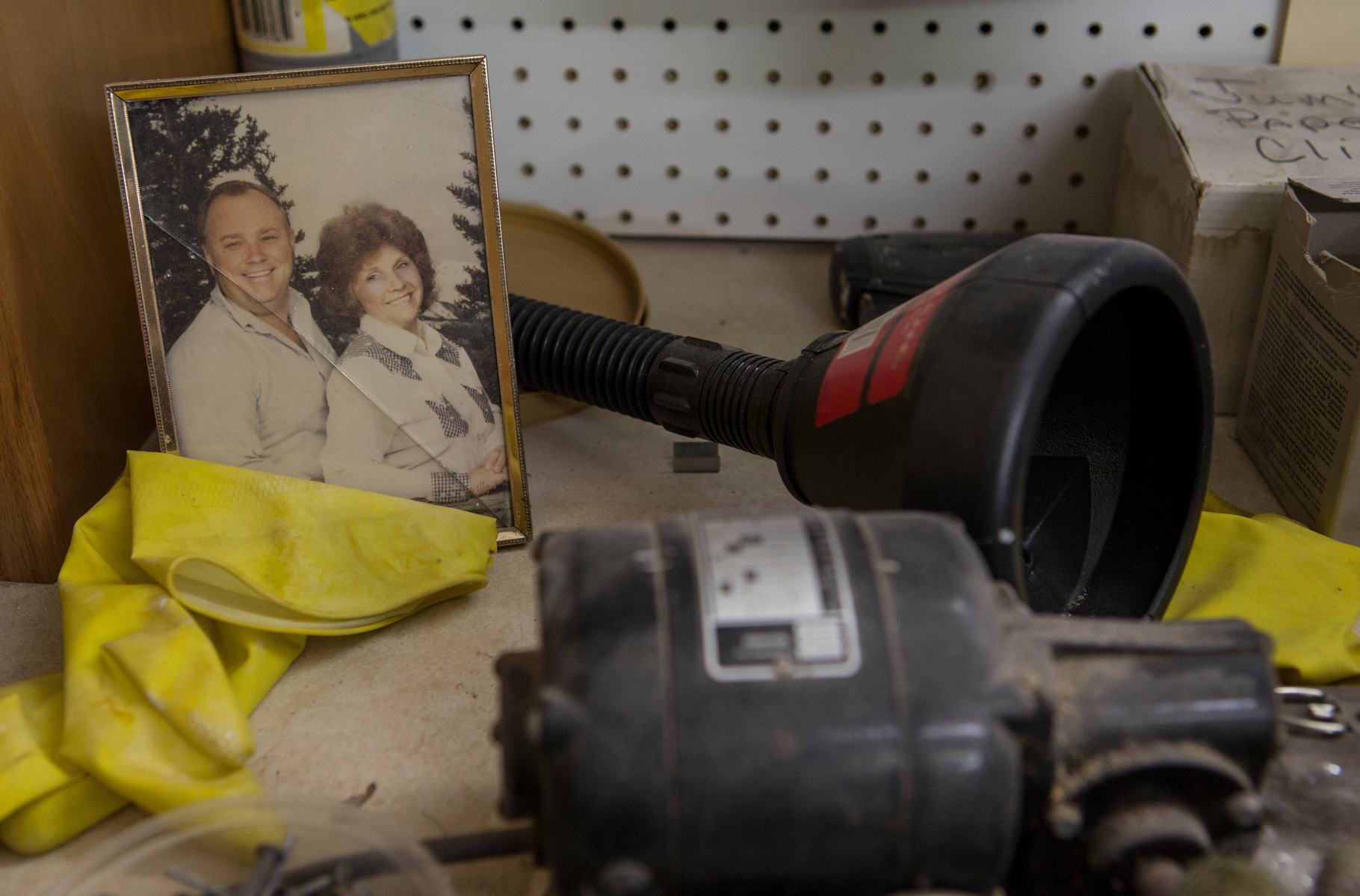 Since his mother's passing five years ago, Howard has kept a photo of her and his father on his workbench at the shop. "We were really close, my mom and me," he says. She had Alzheimers which led Howard to become her caregive