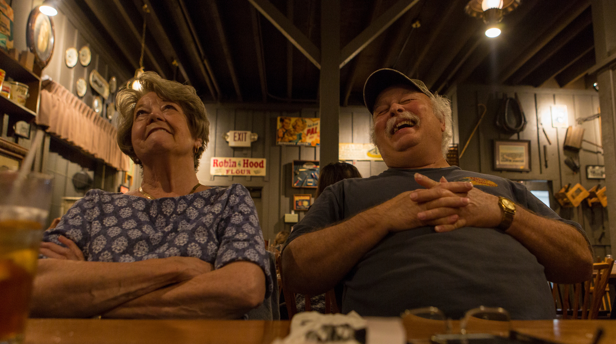 JoAnne and Howard joke with the waiters while waiting for their dinner at Cracker Barrell. As they are frequent the restaurant about once a week, they have come to know most of the staff there.