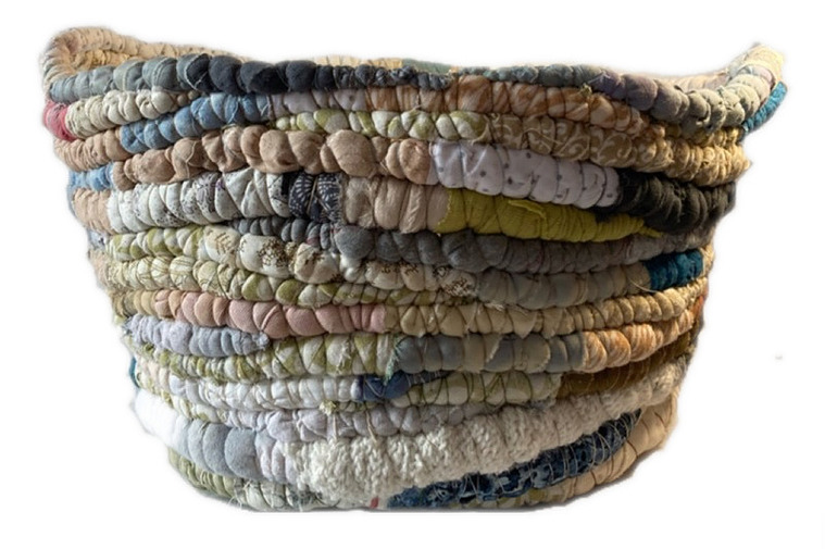 A laundry basket for my client Sandy.  The colours are called Sand and Sea.  She actually puts magazines in it now.  
mostly made with hand dyed and reclaimed cotton.  Filled with fleece/plastic film hybrid.