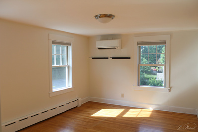 Real Estate Photography, in Westchester County, New York by Vermont-based Artist & Photographer, Kevin Michael Smith. photo of bedroom with two windows and natural light, with hardwood floors.
Rutland Photographer.