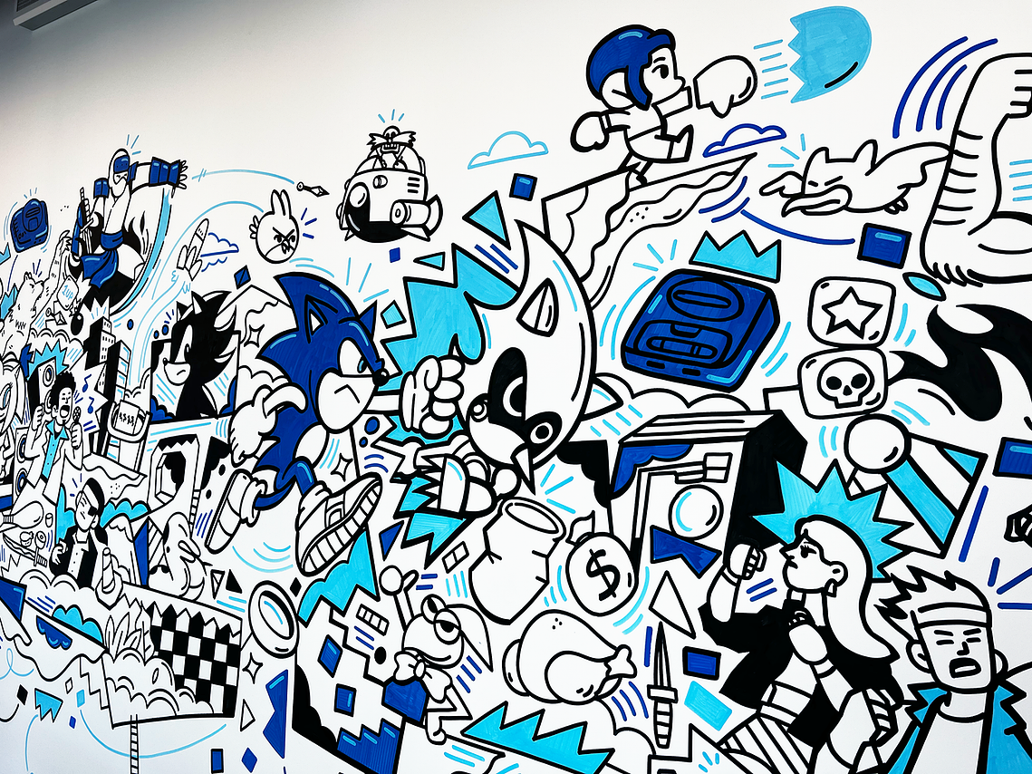 Illustrator Geo Law doodles a mural for Sega europe in London featuring characters like Sonic the Hedgehog, Shinobi, Streets of Rage and more