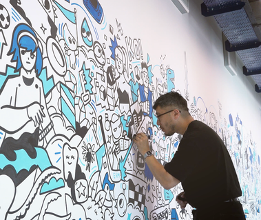 Illustrator Geo Law doodles a mural for Sega europe in London featuring characters like Sonic the Hedgehog, Shinobi, Streets of Rage and more