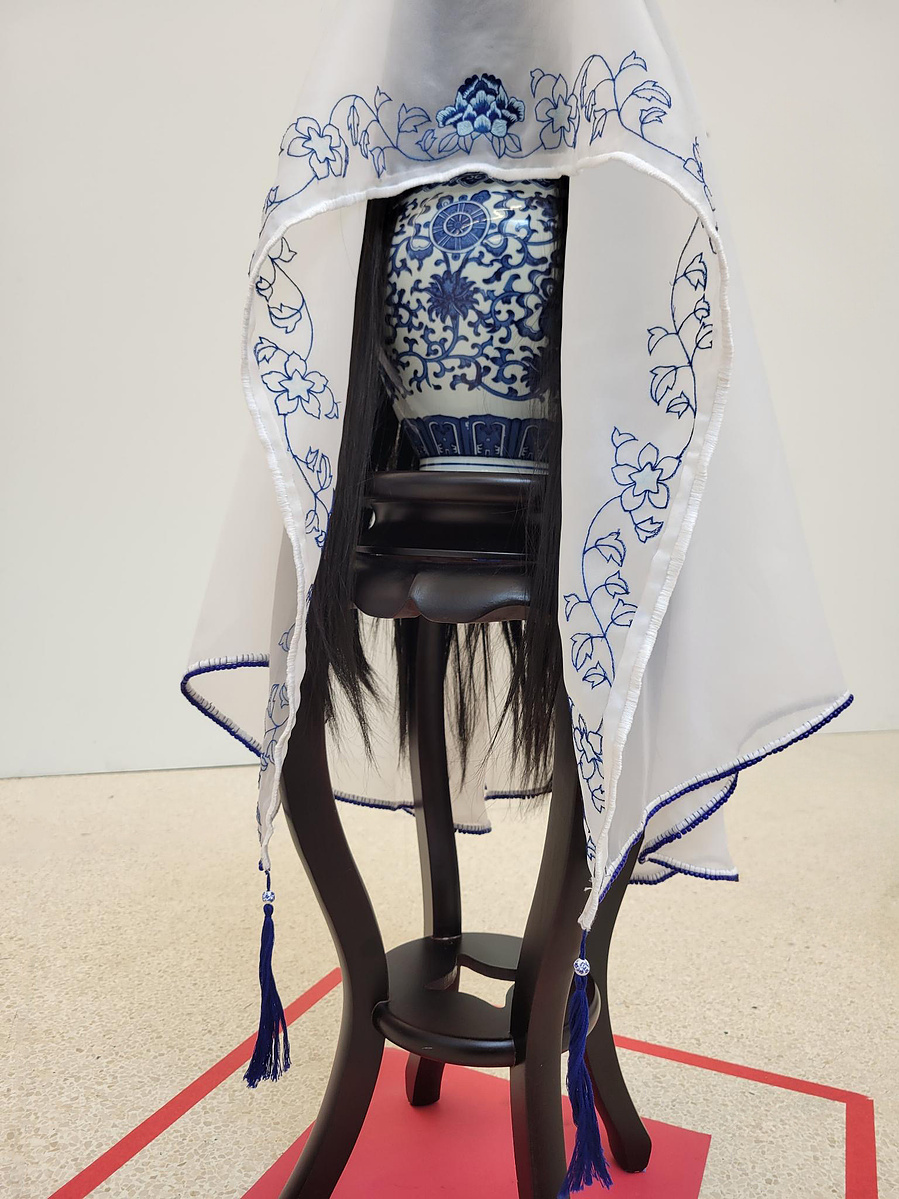 sculptural installation featuring hand embroidery and beadwork on a silk wedding veil.