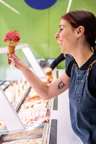 Close-up of red gelato cone held by woman at Melbourne dessert bar – lifestyle food photography by Marcie Raw