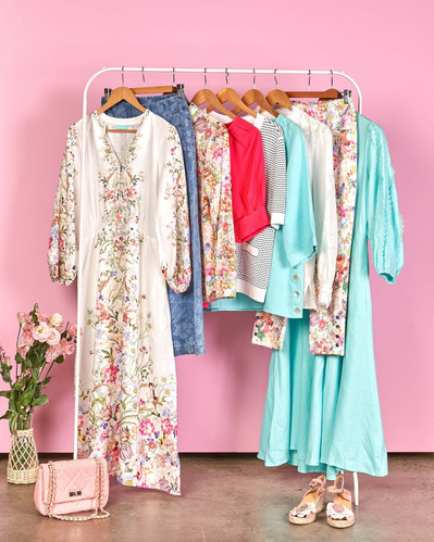 a range of summer clothing on a clothing rack