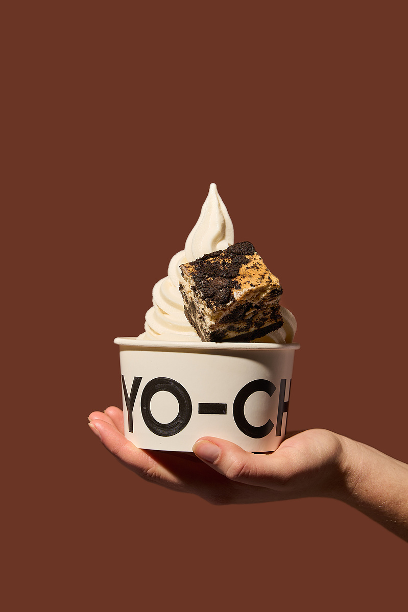 Hand holding Yo Chi frozen yoghurt with brownie — product photography Melbourne