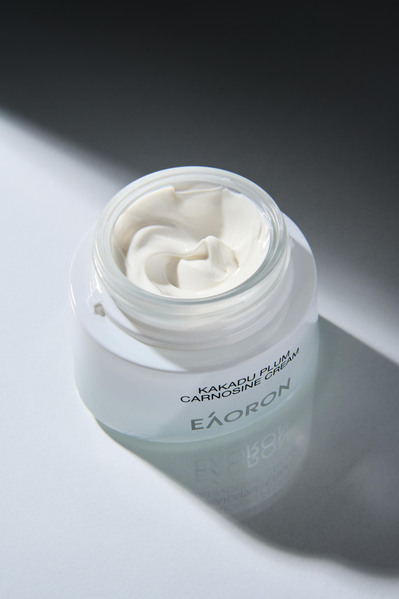 a face cream open on a white background