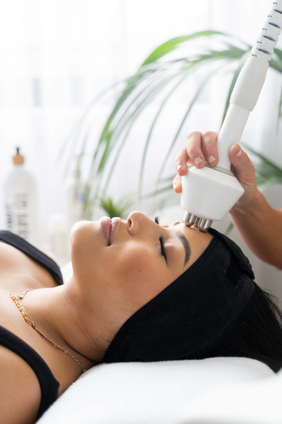 a close up of a women's head during the beauty procedure in the salon